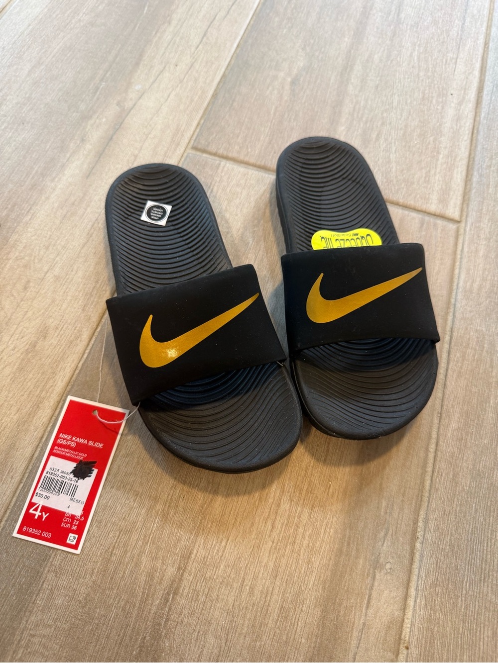 Nike Black and Gold Kids Slide Sandals